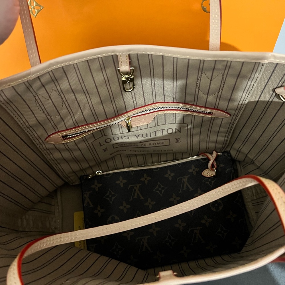 Brand new spacious tote with removable pouch.